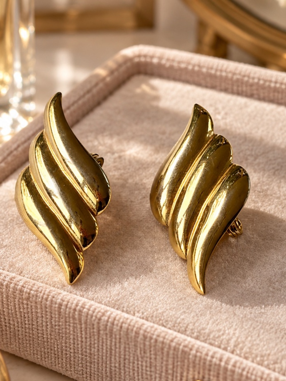Vintage MONET Signed Gold Tone Ribbed Wave Clip On Earrings.
